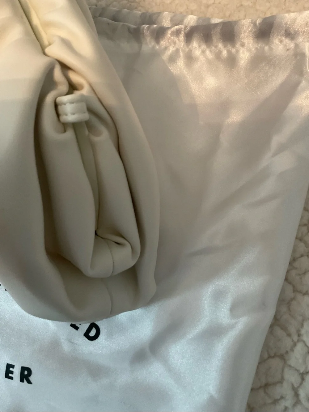 Understated Leather crescent cream